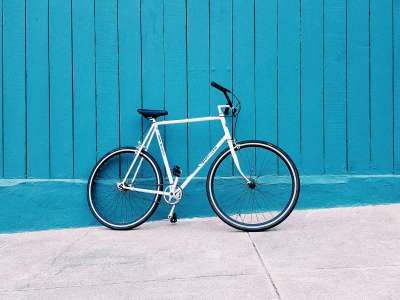 White-bike-against-blue-wall-2021
